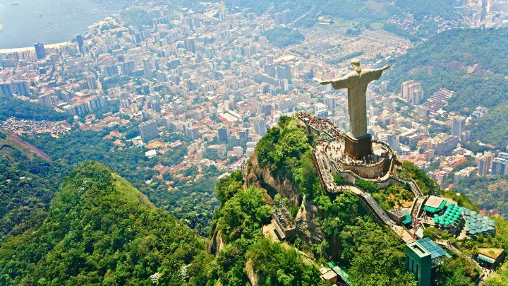 View of Christ the Redeemer rising above Rio de Janeiro with expansive cityscape