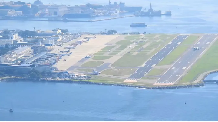Panoramic view of Rio de Janeiro airport with cityscape and coastline in the background