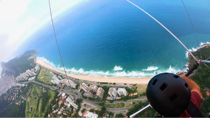 Hang gliding over Rio de Janeiro with ocean and forest views