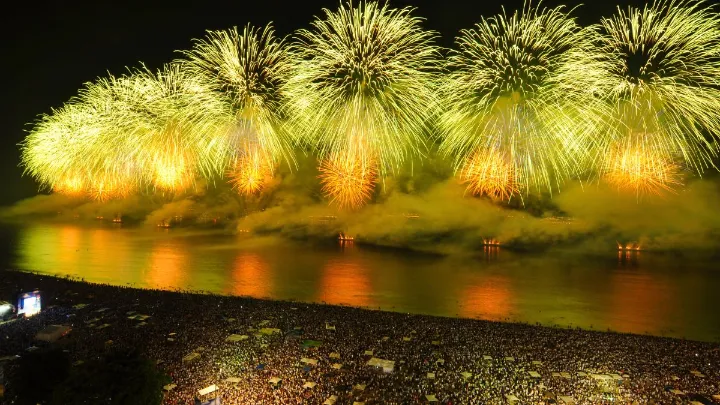 Crowds enjoy the Rio de Janeiro New Year fireworks on Copacabana Beach